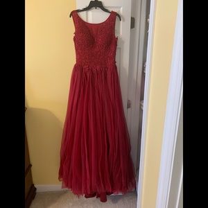 A beautiful deep red Mac Duggal gown